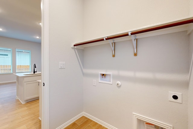 washroom featuring electric dryer hookup, hookup for a gas dryer, sink, and hookup for a washing machine