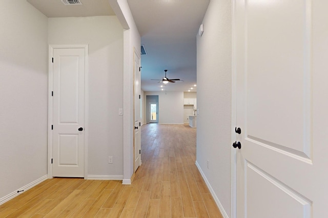 corridor featuring light wood-type flooring