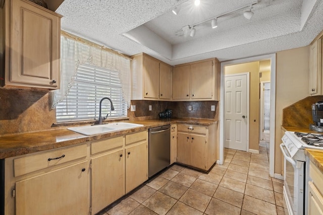 kitchen featuring dishwasher, white stove, a raised ceiling, and sink