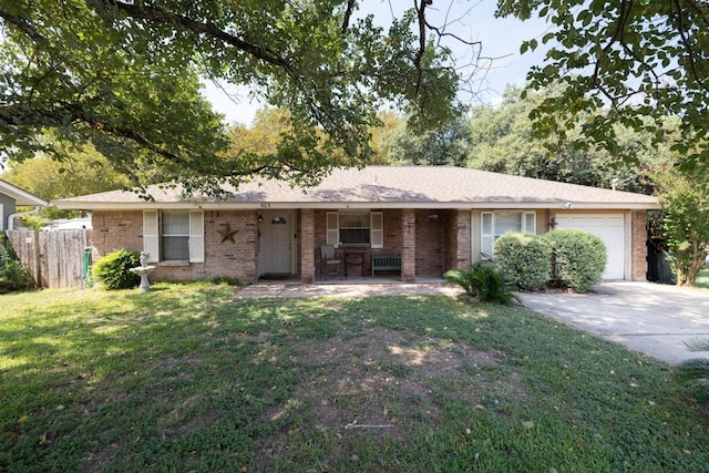 ranch-style home featuring a garage and a front yard