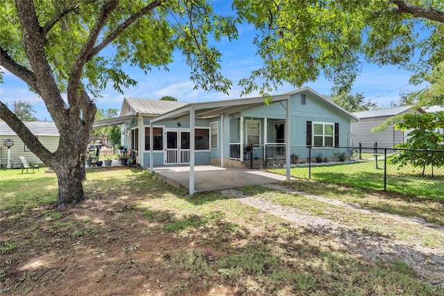 back of property featuring a lawn