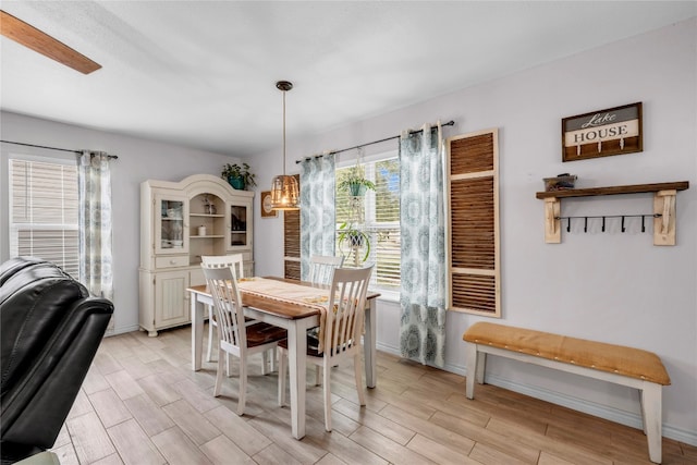 dining space featuring light wood-type flooring