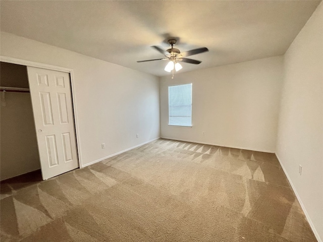 unfurnished bedroom with a closet, ceiling fan, and carpet flooring