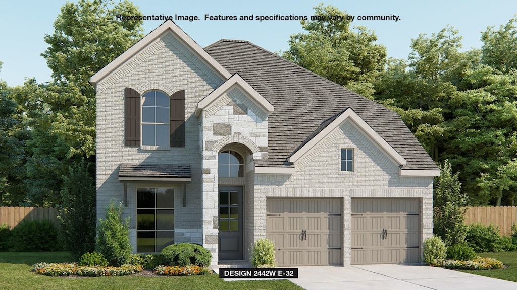 french provincial home with a garage and a front yard