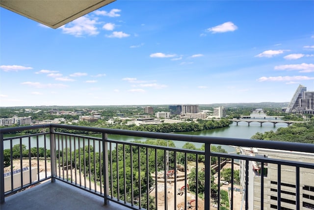 balcony featuring a view of city and a water view