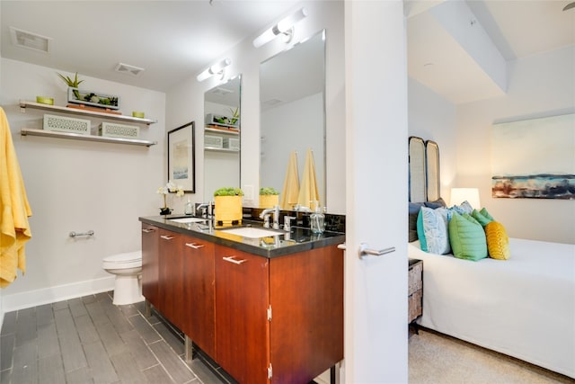 bathroom featuring hardwood / wood-style floors, toilet, and vanity