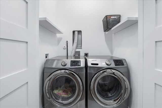 laundry room featuring separate washer and dryer