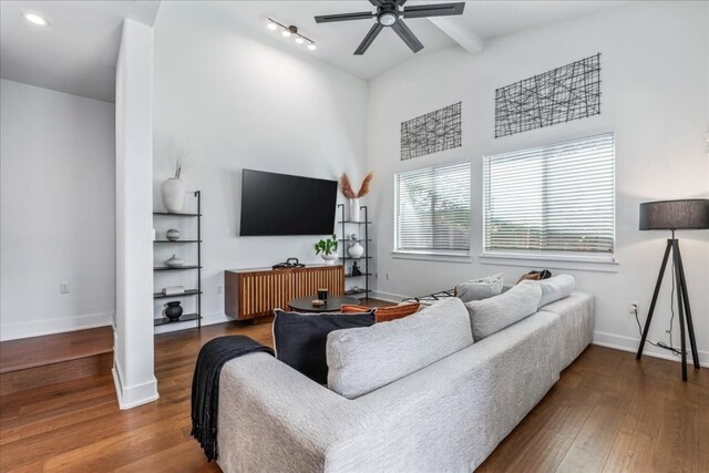 living room featuring wood-type flooring and ceiling fan