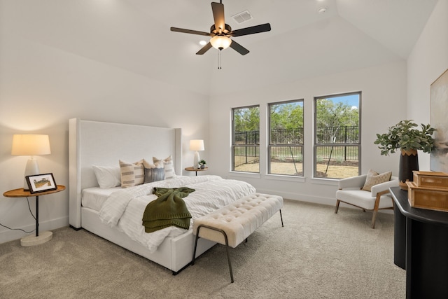 bedroom with ceiling fan, high vaulted ceiling, and carpet floors