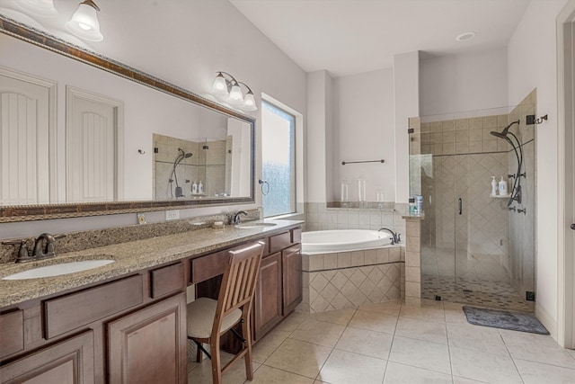 bathroom with plus walk in shower, tile patterned floors, and vanity