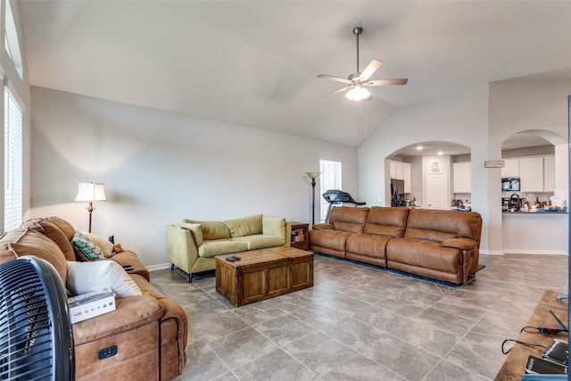 living room with high vaulted ceiling and ceiling fan