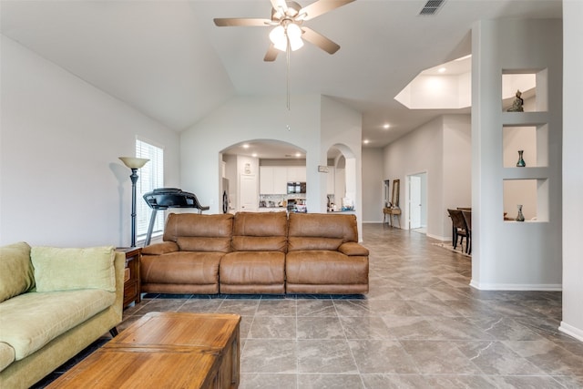 living room featuring built in features, high vaulted ceiling, and ceiling fan