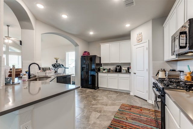 kitchen featuring black appliances, ceiling fan, sink, and white cabinetry