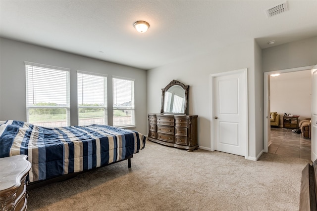 bedroom with light carpet