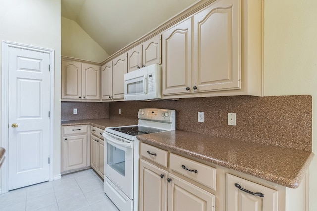 kitchen with decorative backsplash, white appliances, vaulted ceiling, and light tile patterned floors