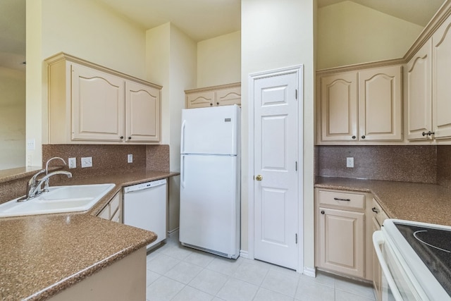 kitchen with light tile patterned flooring, sink, decorative backsplash, white appliances, and light brown cabinetry