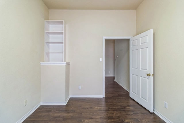 empty room featuring dark wood-type flooring