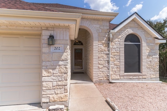 doorway to property featuring a garage