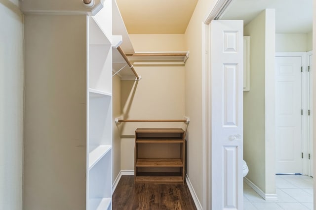 spacious closet with hardwood / wood-style floors