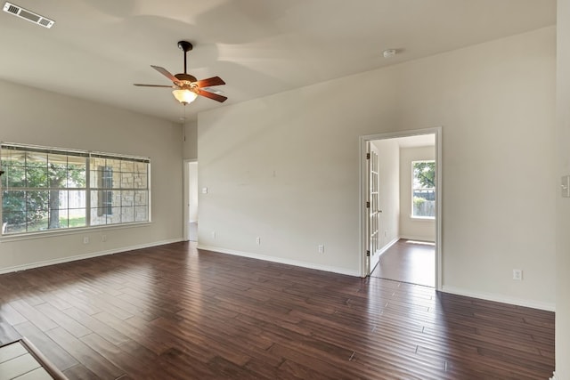 spare room featuring ceiling fan and dark hardwood / wood-style floors