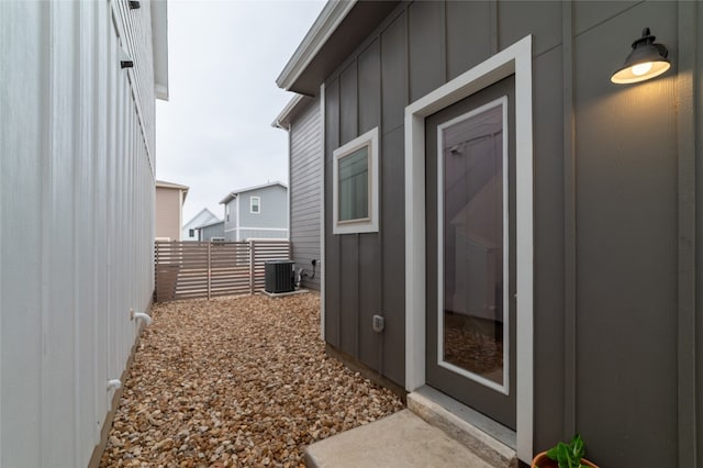 doorway to property with central AC unit