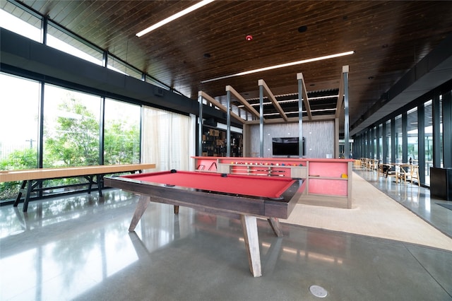 rec room with pool table and concrete flooring