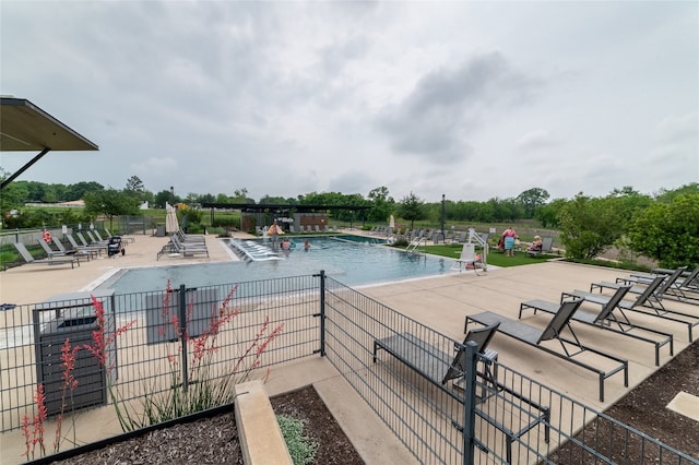 view of swimming pool with a patio area