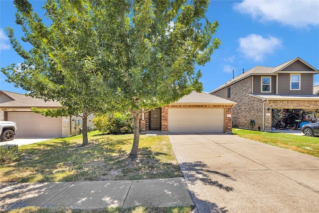 view of front of home with a front yard and a garage