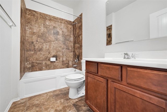 full bathroom with vanity, toilet, and tiled shower / bath