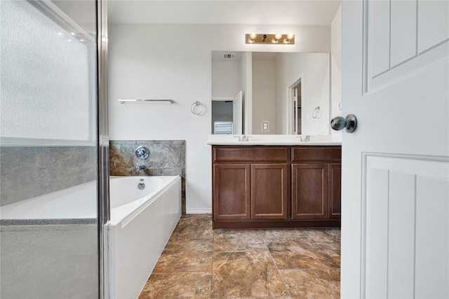 bathroom featuring vanity and a bathing tub