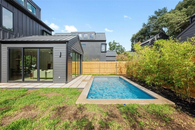 view of pool featuring a patio area