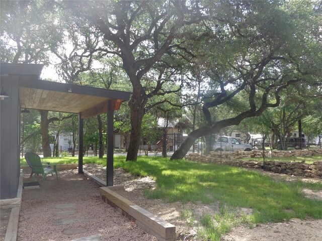 view of yard featuring a storage unit