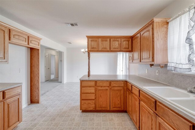 kitchen with kitchen peninsula and sink