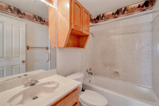 full bathroom featuring vanity, a textured ceiling, toilet, and washtub / shower combination