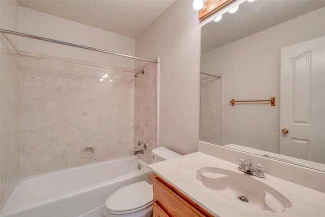 full bathroom featuring shower / washtub combination, vanity, and toilet