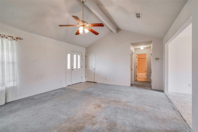 interior space featuring lofted ceiling with beams, light carpet, and ceiling fan