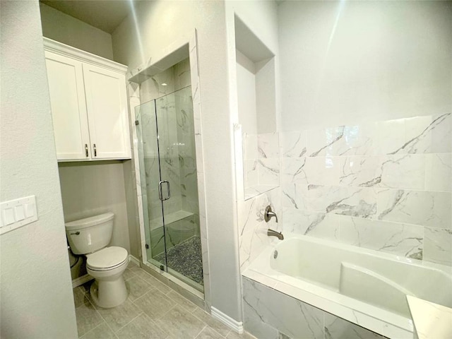 bathroom featuring plus walk in shower, tile patterned floors, and toilet