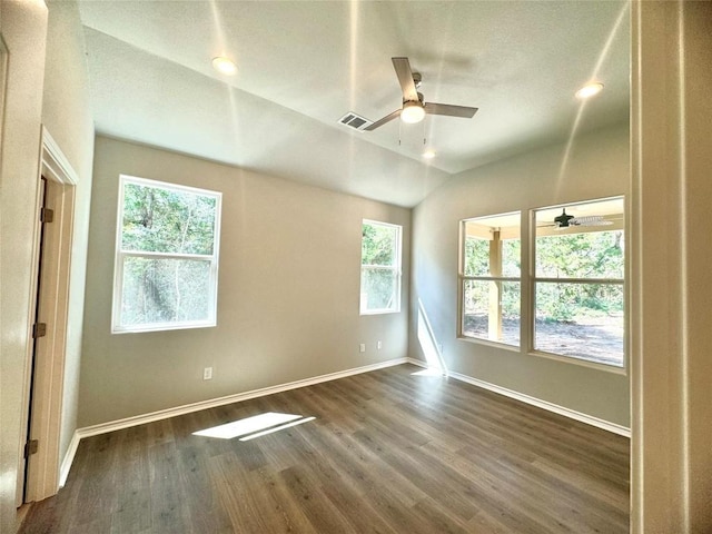 empty room featuring ceiling fan, dark hardwood / wood-style flooring, and lofted ceiling
