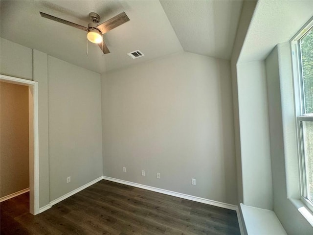 unfurnished room featuring dark hardwood / wood-style flooring, ceiling fan, and lofted ceiling