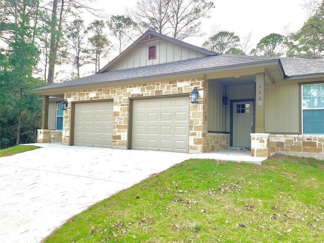 view of front of home with a garage and a front yard