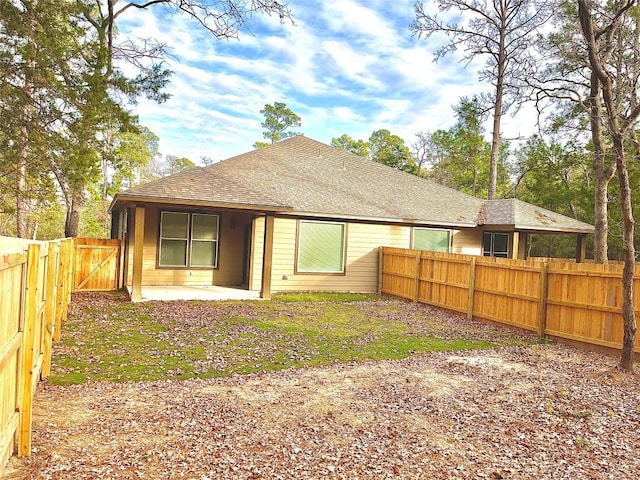 rear view of property featuring a patio area