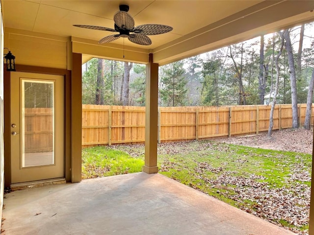 view of yard with ceiling fan and a patio area