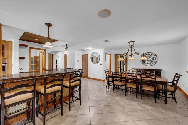 dining room featuring light tile patterned flooring