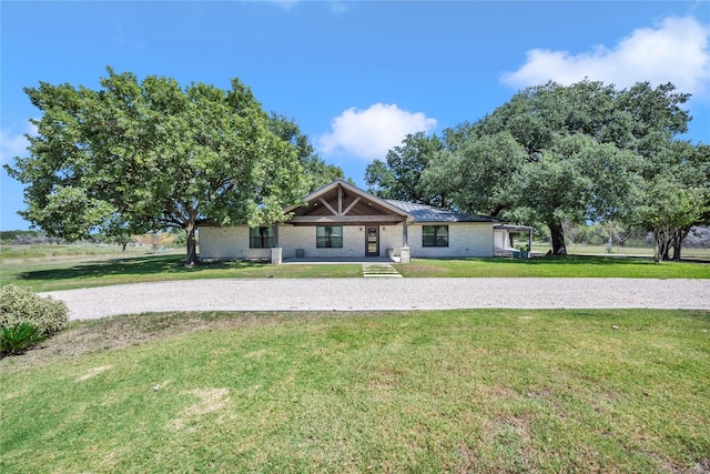 ranch-style home with a front yard