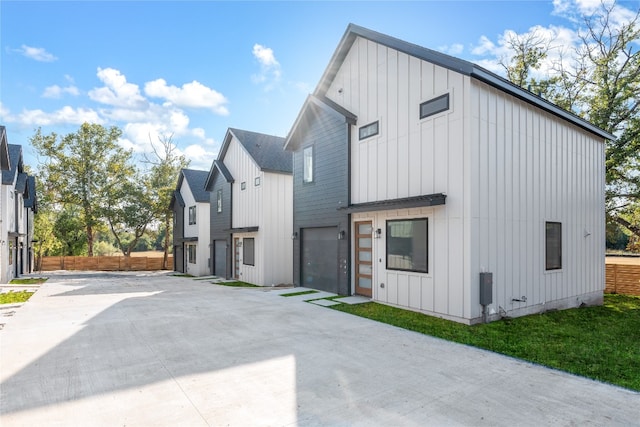 view of side of home featuring a garage