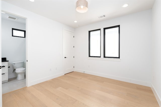 spare room with hardwood / wood-style floors