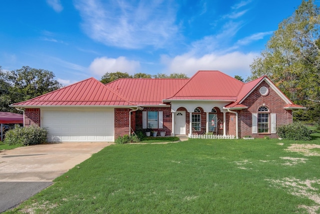 view of front facade with a front yard and a garage