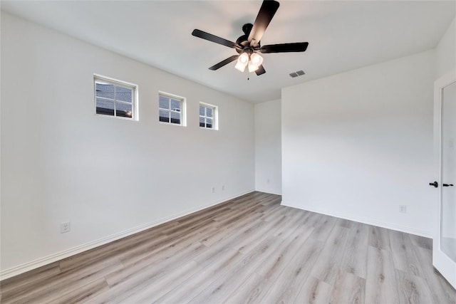 empty room featuring ceiling fan and light hardwood / wood-style floors