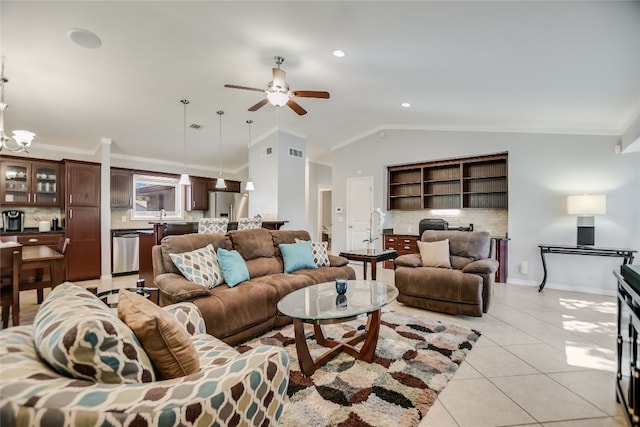 tiled living room featuring ceiling fan with notable chandelier, ornamental molding, and vaulted ceiling