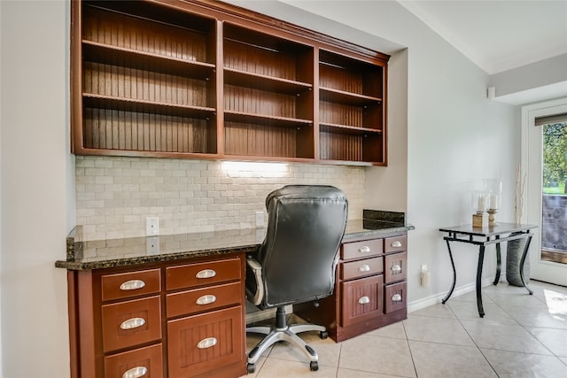 tiled home office featuring lofted ceiling